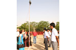 Chairman, Mr. T. P Aggarwal, Director Mrs. Anjali Aggarwal, Manager Mr. L. K. Rai and Principal Mrs. Sethi Unfurling the School Flag on Investiture Ceremony