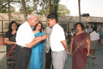 Manager, Mr. L. K Rai presenting a Badge to the School Captain &lsquo;Sanshit Gulati&rsquo;