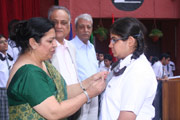 Investiture Ceremony - MONIKA ARORA (XI B) RECEIVING HER BADGE FROM THE PRINCIPAL